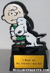 Snoopy hugging Charlie Brown