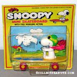 Flying Ace sitting on yellow skateboard