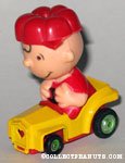 Charlie Brown in yellow car