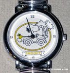 Snoopy driving car by palm trees