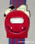 Snoopy lying on top of watch bezel