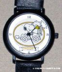 Snoopy driving car by palm trees