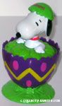 Snoopy cracking out of purple egg with green top Candy Container