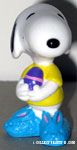 Snoopy holding egg and wearing bunny slippers Easter PVC Figurine