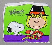 Sally wearing witch hat sorting treats with Snoopy Halloween Chocolate Box