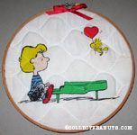 Woodstock bringing Schroeder a heart balloon Fabric in Hoop