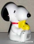 Snoopy sitting Holding Woodstock