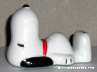 Snoopy lying on back