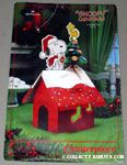 Snoopy & Woodstock decorating Honeycomb Christmas Tree on top of doghouse Centerpiece