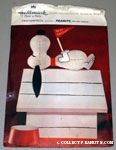 Snoopy laying on doghouse holding flag 'Happy Birthday' Centerpiece