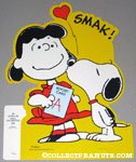Lucy being kissed by Snoopy holding A+ Report Card Press-out