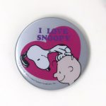 Snoopy sitting on Charlie Brown