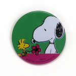 Woodstock giving Snoopy a flower Button