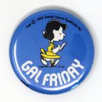 Lucy writing on note pad ‘Gal Friday’ Button