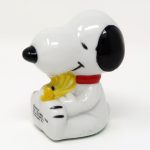 Snoopy sitting with Woodstock Paperweight