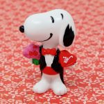Snoopy wearing tuxedo holding flowers and candy Valentine