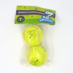Snoopy kicking dog tennis balls