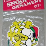 Snoopy standing in front of snowflake Wood Ornament