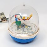 Santa Snoopy and Woodstocks flying over houses Ornament