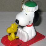 Snoopy and Woodstock on red sled Ornament
