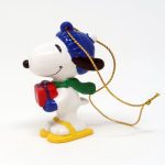 Snoopy holding present and wearing snowshoes Ornament