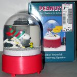 Snoopy & Woodstock playing Hockey Music Box Snowglobe