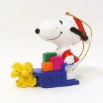 Santa Snoopy driving sleigh pulled by Woodstocks Ornament