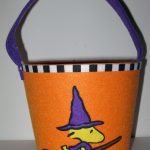 Woodstock as witch on broom Treat Bucket