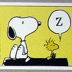 Woodstock sleeping on doghouse Sticker