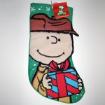 Charlie Brown holding gift Christmas Stocking
