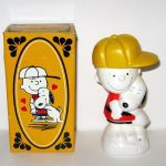 Snoopy hugging Charlie Brown Avon Bottle