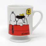Snoopy & Woodstock sleeping on doghouse footed Mug