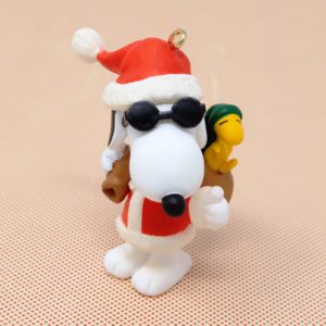 Joe Cool as Santa with Woodstock in bag Ornament