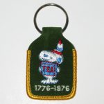 Snoopy holding box of tea Keychain