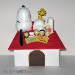 Snoopy on doghouse with Peanuts Gang banner Bank