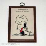Snoopy hugging Charlie Brown 'Happiness is having a friend' Plaque