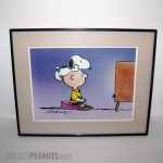 Snoopy sitting on Charlie Brown's head Print