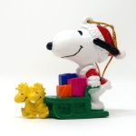 Santa Snoopy driving green sleigh Ornament