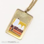 Snoopy laying on Doghouse Dog Tag style Necklace