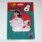 Snoopy Rolling Lucy into Snowball Christmas Ornament