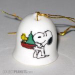Snoopy holding Woodstock's nest with Christmas tree Ornament Bell