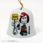 Snoopy holding Joy Sign with Peppermint Patty Christmas Ornament Bell