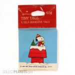 Snoopy and Woodstock wrapped up on Christmas Doghouse Gift Tags