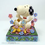 Snoopy and Woodstock in pile of flowers Figurine