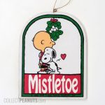 Snoopy hugging Charlie Brown under Mistletoe Wooden Ornament