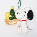 Snoopy holding Woodstock's Nest Christmas Ornament