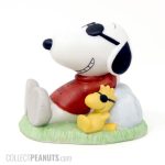 Joe Cool & Woodstock laying on grass Figurine