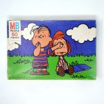 Linus holding Peppermint Patty's Nose Puzzle
