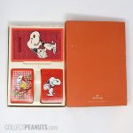 Snoopy with cards and Woodstock in house of cards Double-deck set with score pad