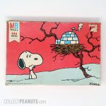 Snoopy standing in snow with Igloo Bird House Puzzle
